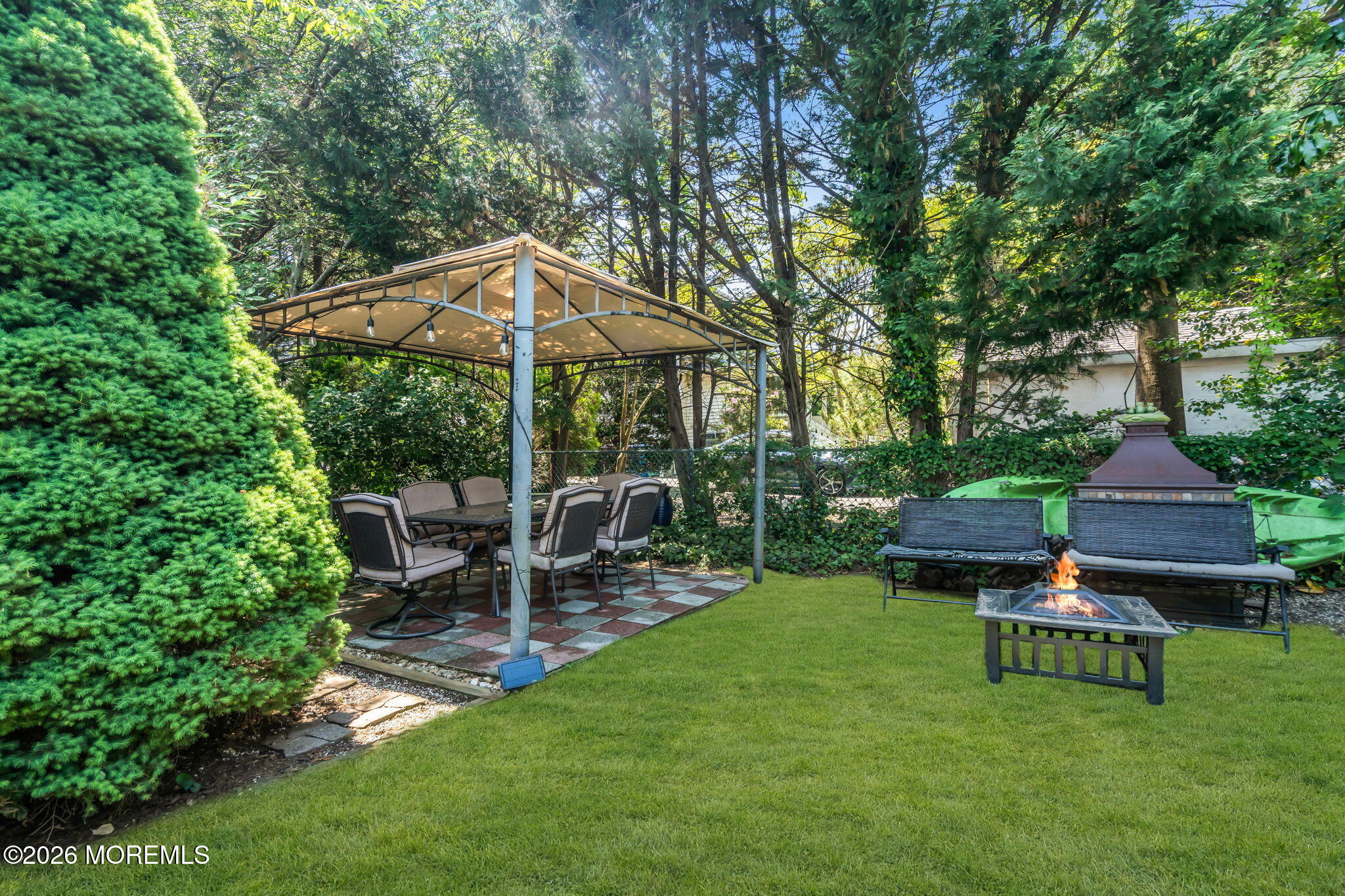 24 Foster Street Middletown, NJ 07701 - Photo 17 of 23 a view of a chair and table in backyard of the house