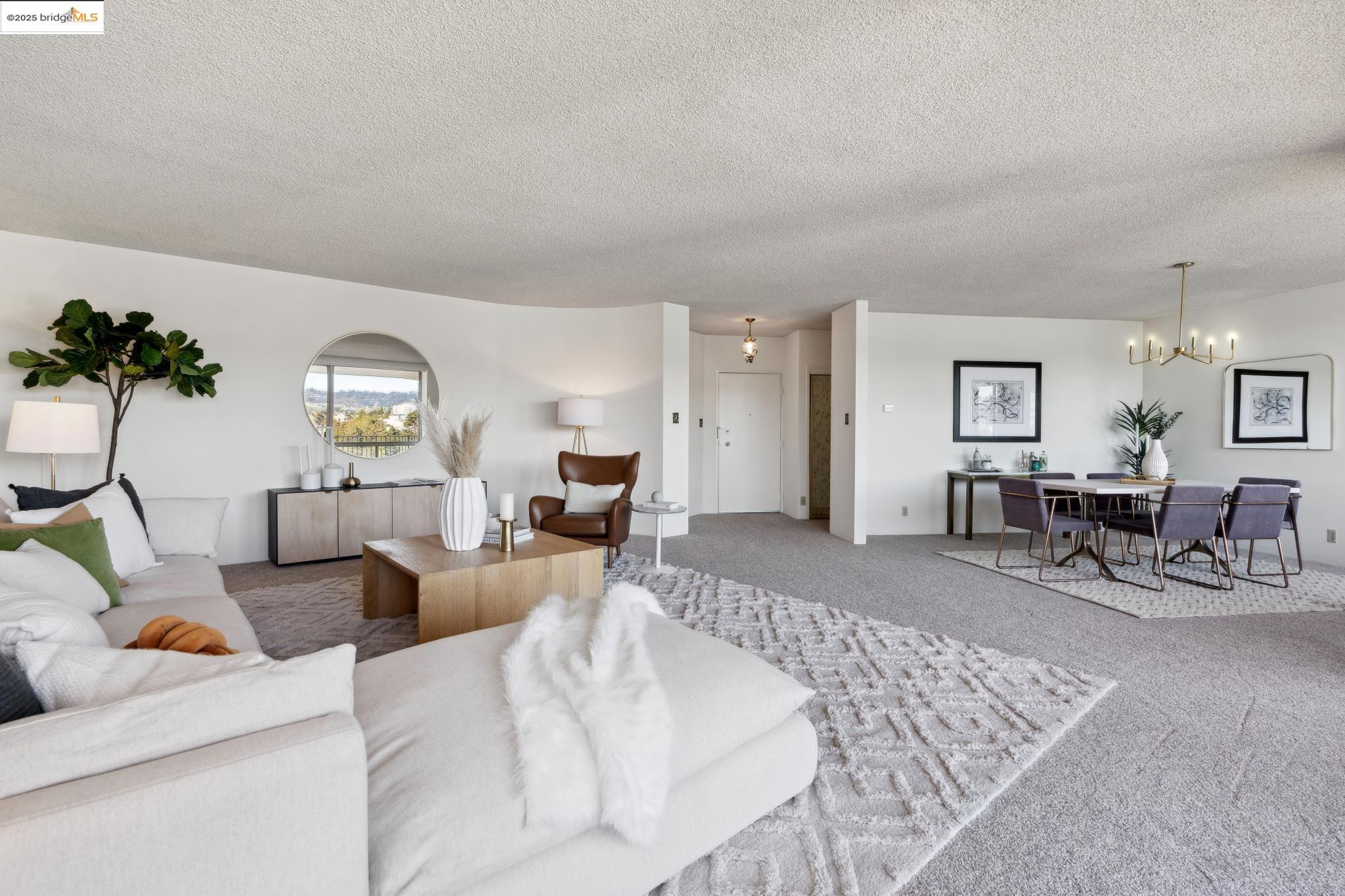 177 19th Street, Unit 5A Oakland, CA 94612 - Photo 15 of 49 a living room with furniture and wooden floor