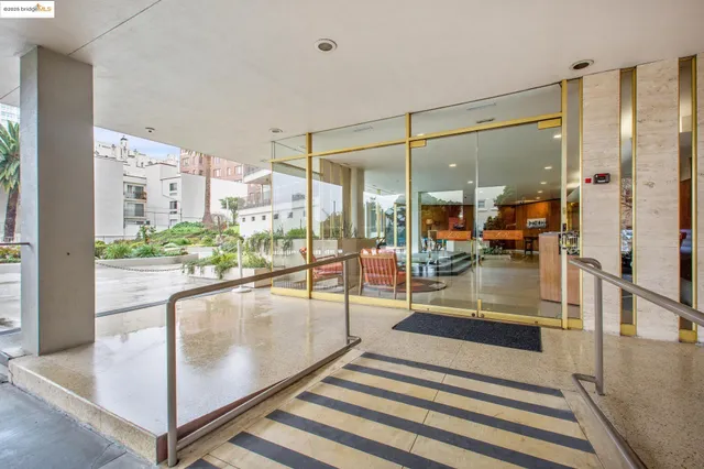 a view of a living room and entry gate