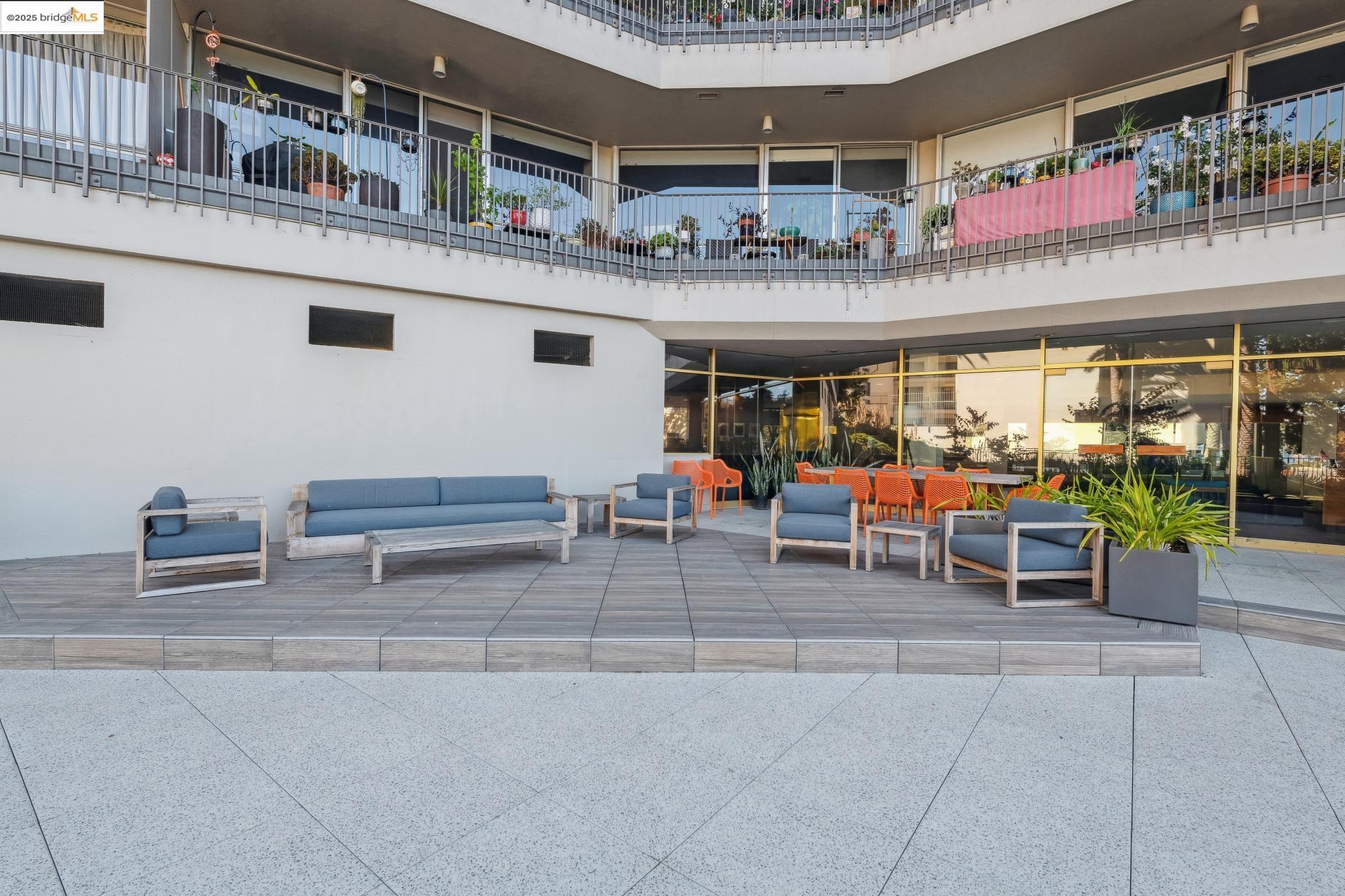 177 19th Street, Unit 5A Oakland, CA 94612 - Photo 41 of 49 a outdoor space with lots of table and chairs