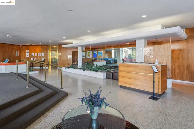 a lobby with furniture and window