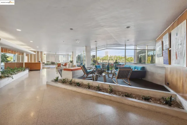 a living room with lots of furniture and a table