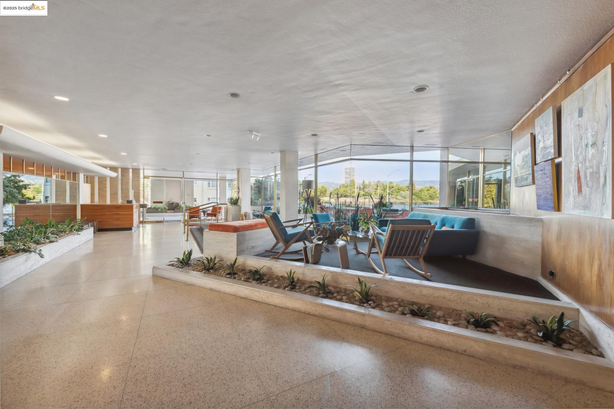 177 19th Street, Unit 5A Oakland, CA 94612 - Photo 9 of 49 a living room with lots of furniture and a table
