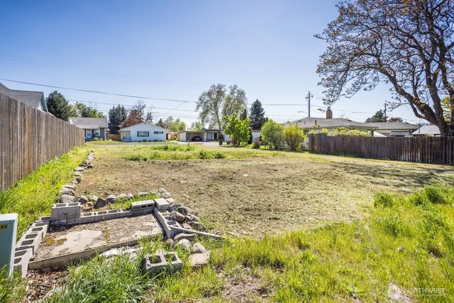 a view of backyard with patio