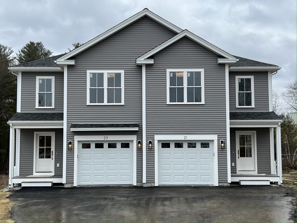 20 Sandy Pond Road, Unit 20 Ayer, MA 01432 - Photo 1 of 25 a front view of a house