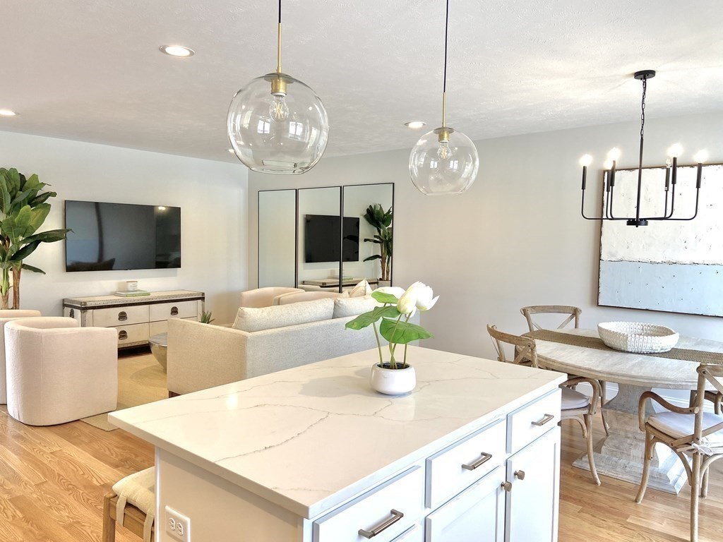 20 Sandy Pond Road, Unit 20 Ayer, MA 01432 - Photo 11 of 25 a kitchen with a table and chairs in it