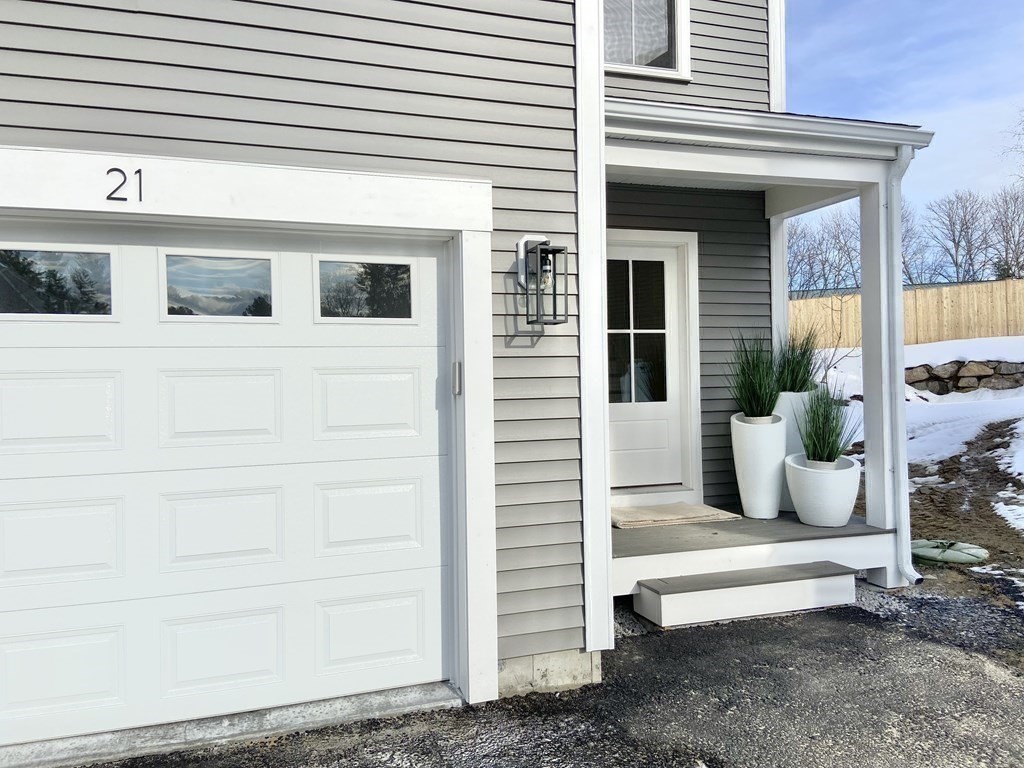 20 Sandy Pond Road, Unit 20 Ayer, MA 01432 - Photo 24 of 25 a front view of a house with a chair