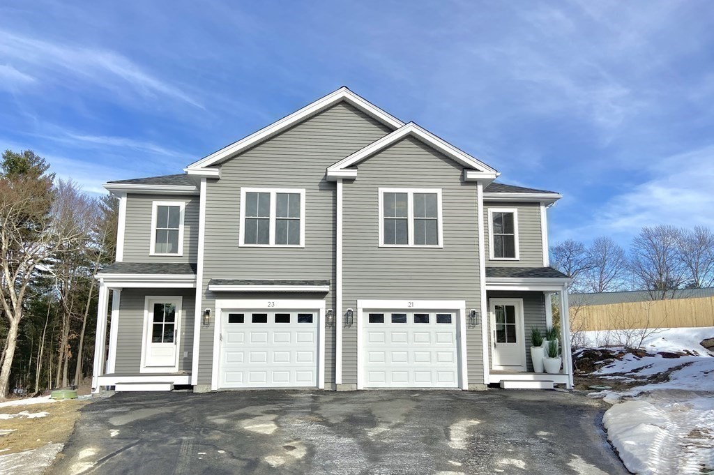 20 Sandy Pond Road, Unit 20 Ayer, MA 01432 - Photo 25 of 25 a front view of a house with a yard