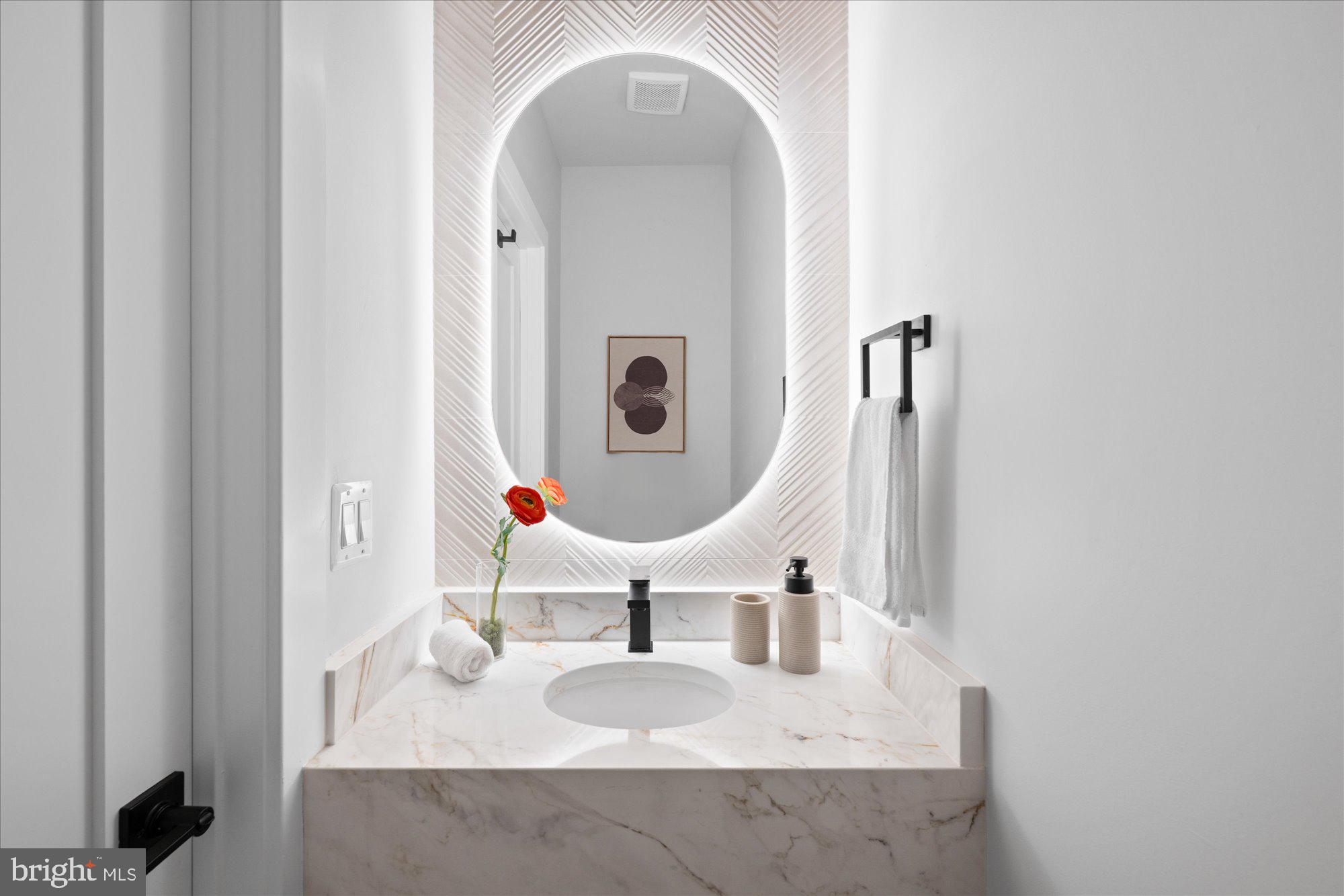 4441 Harrison Street Northwest Washington, DC 20015 - Photo 13 of 43 a bathroom with mirror and sink