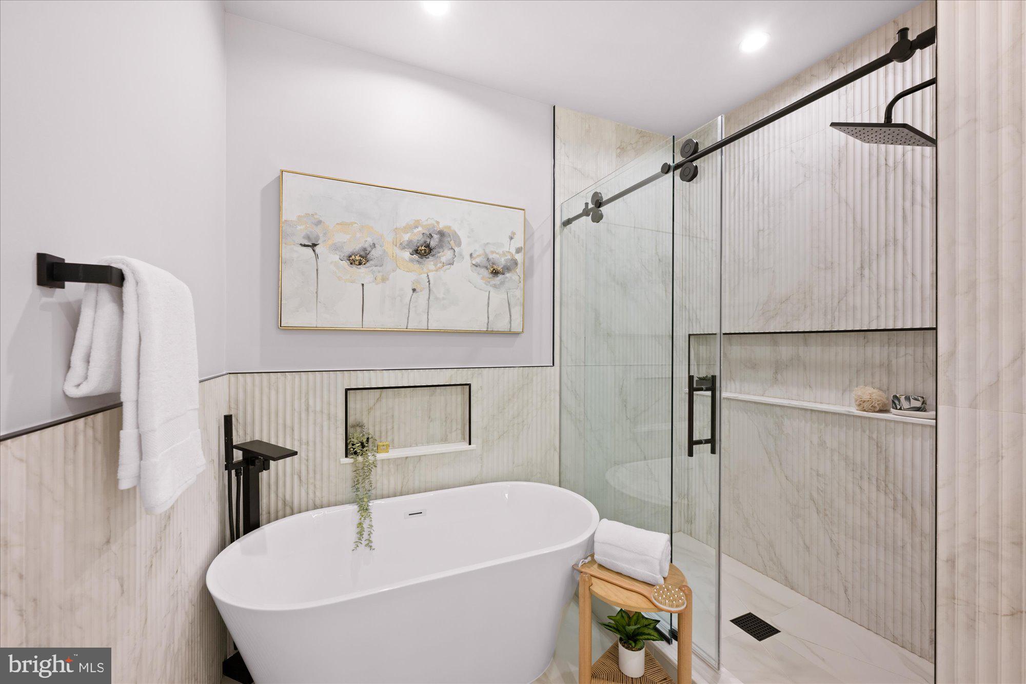 4441 Harrison Street Northwest Washington, DC 20015 - Photo 28 of 43 a bathroom with a bathtub and a shower