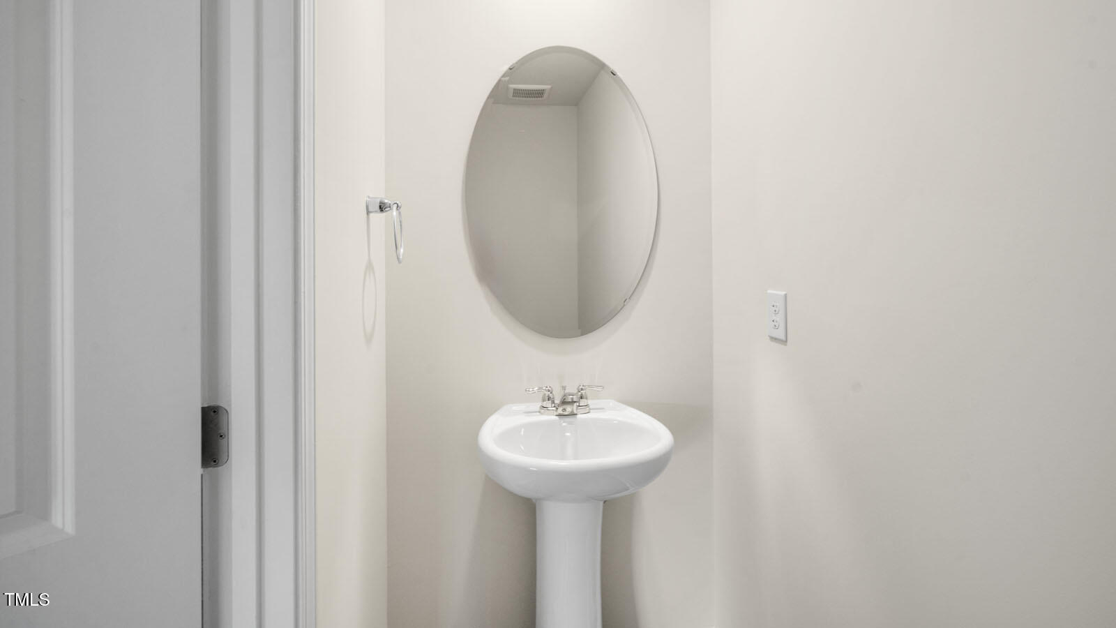 6016 Sodium Street Raleigh, NC 27610 - Photo 15 of 22 a bathroom with a sink and a mirror