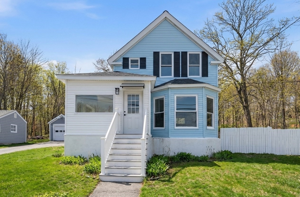 a front view of a house with a yard
