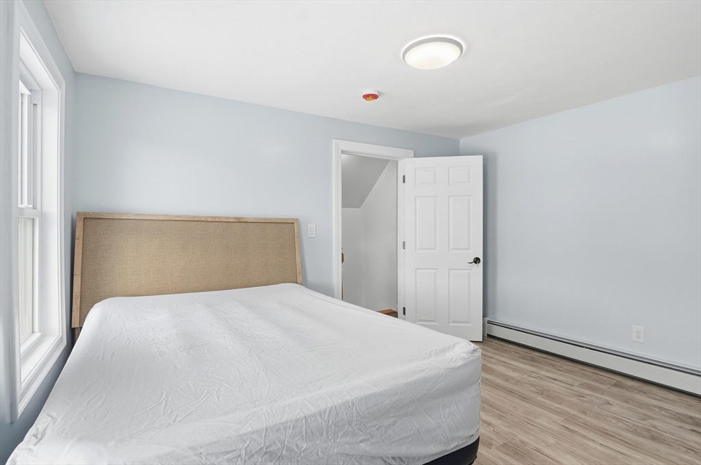 104 Temple Street Gardner, MA 01440 - Photo 25 of 40 a large white bed in a white room