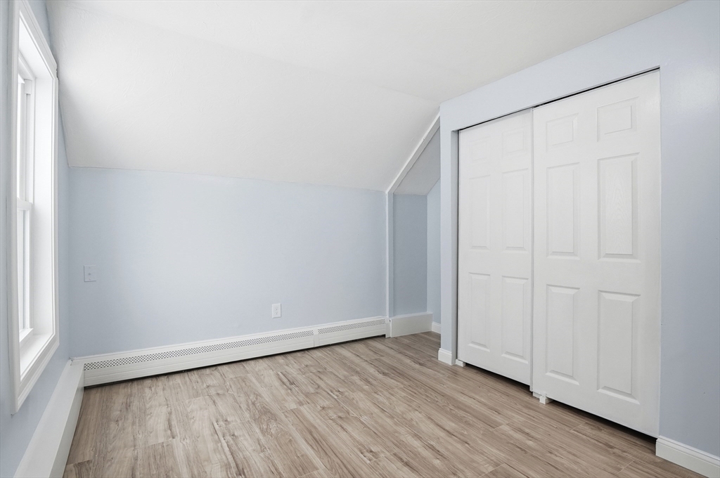104 Temple Street Gardner, MA 01440 - Photo 27 of 40 a view of an empty room with wooden floor