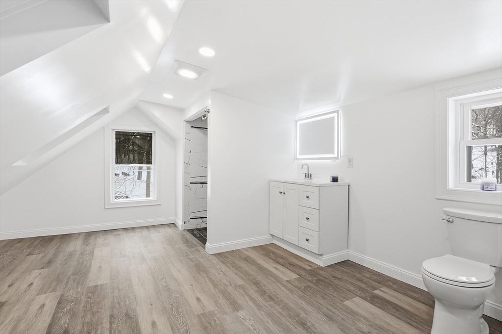 104 Temple Street Gardner, MA 01440 - Photo 33 of 40 a bathroom with a sink a toilet and mirror
