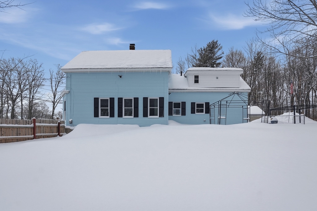 104 Temple Street Gardner, MA 01440 - Photo 39 of 40 a view of a house with a snow in the yard