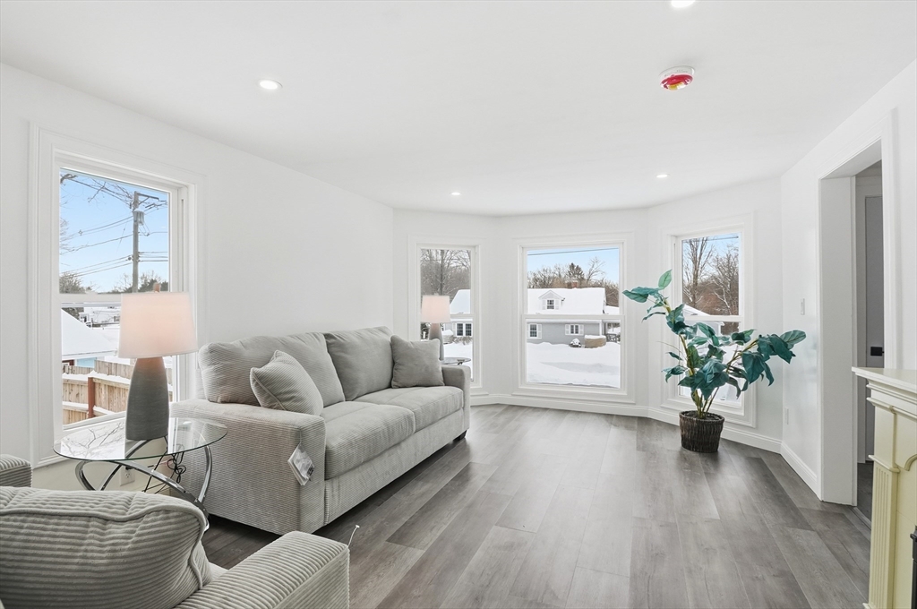 104 Temple Street Gardner, MA 01440 - Photo 4 of 40 a living room with furniture flowerpot and wooden floor