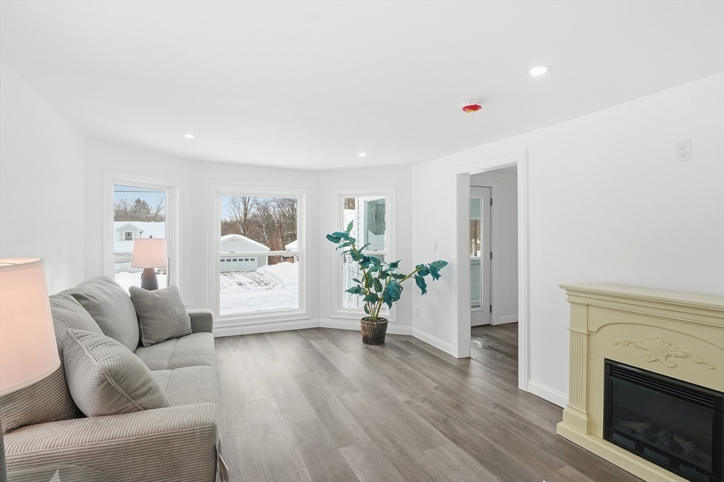 104 Temple Street Gardner, MA 01440 - Photo 7 of 40 a living room with furniture and a fireplace
