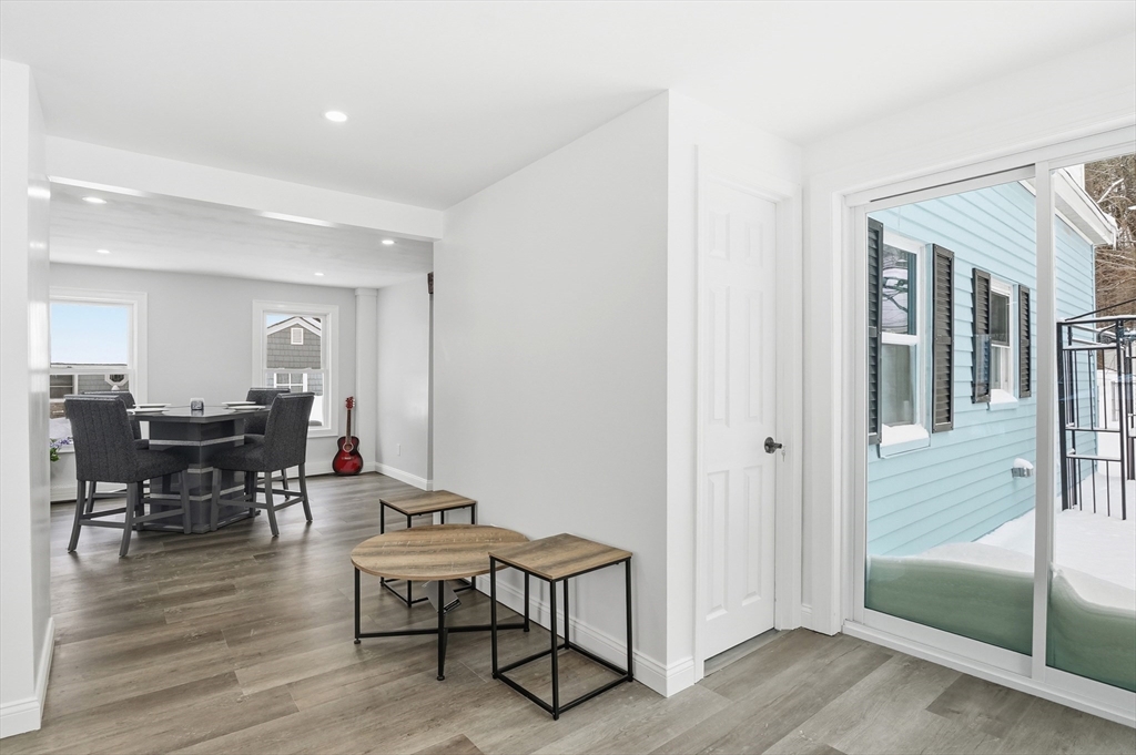 104 Temple Street Gardner, MA 01440 - Photo 10 of 40 a living room with furniture a dining table and wooden floor