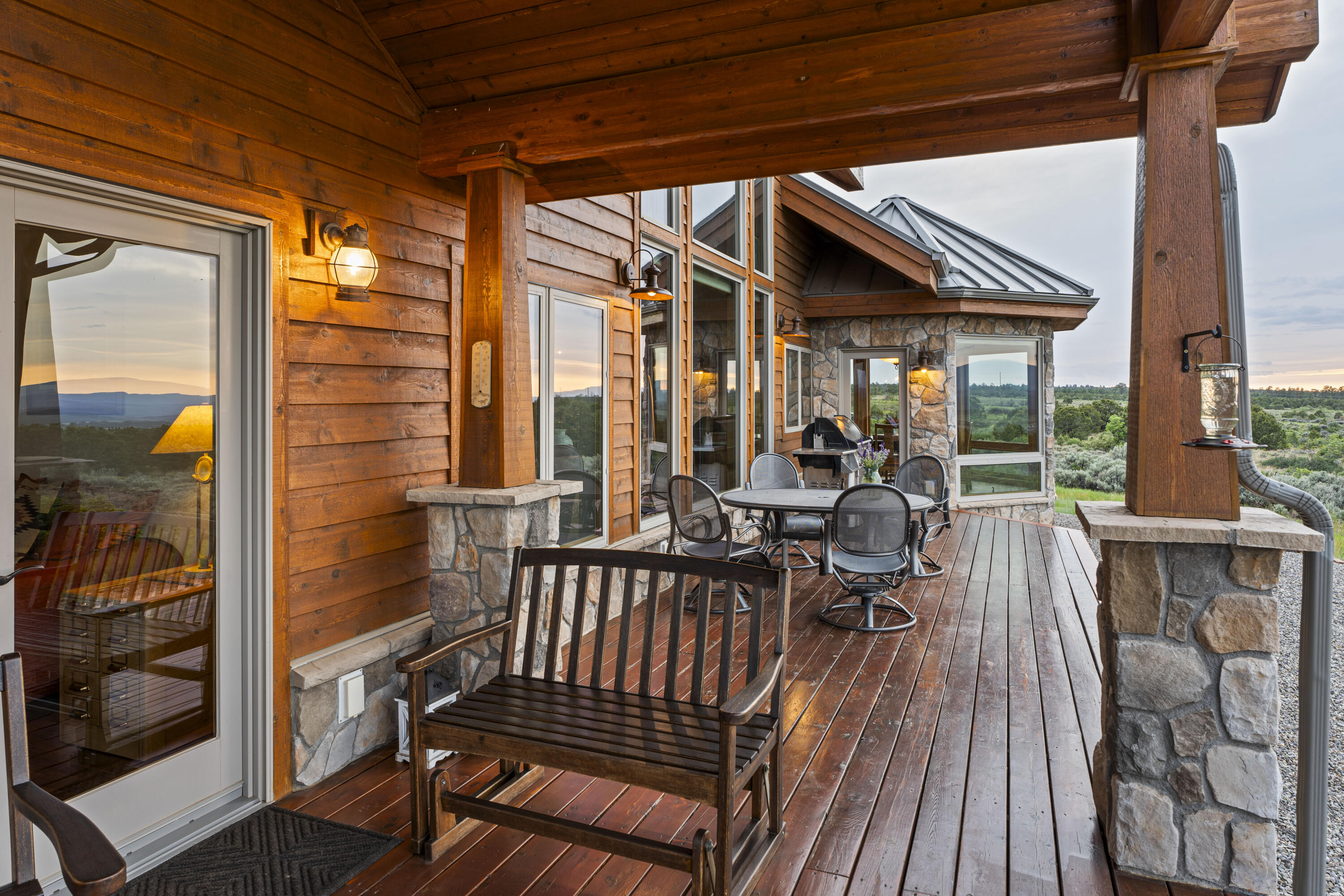 3100 South County Road Norwood, CO 81423 - Photo 11 of 44 a view of balcony with couch and wooden floor