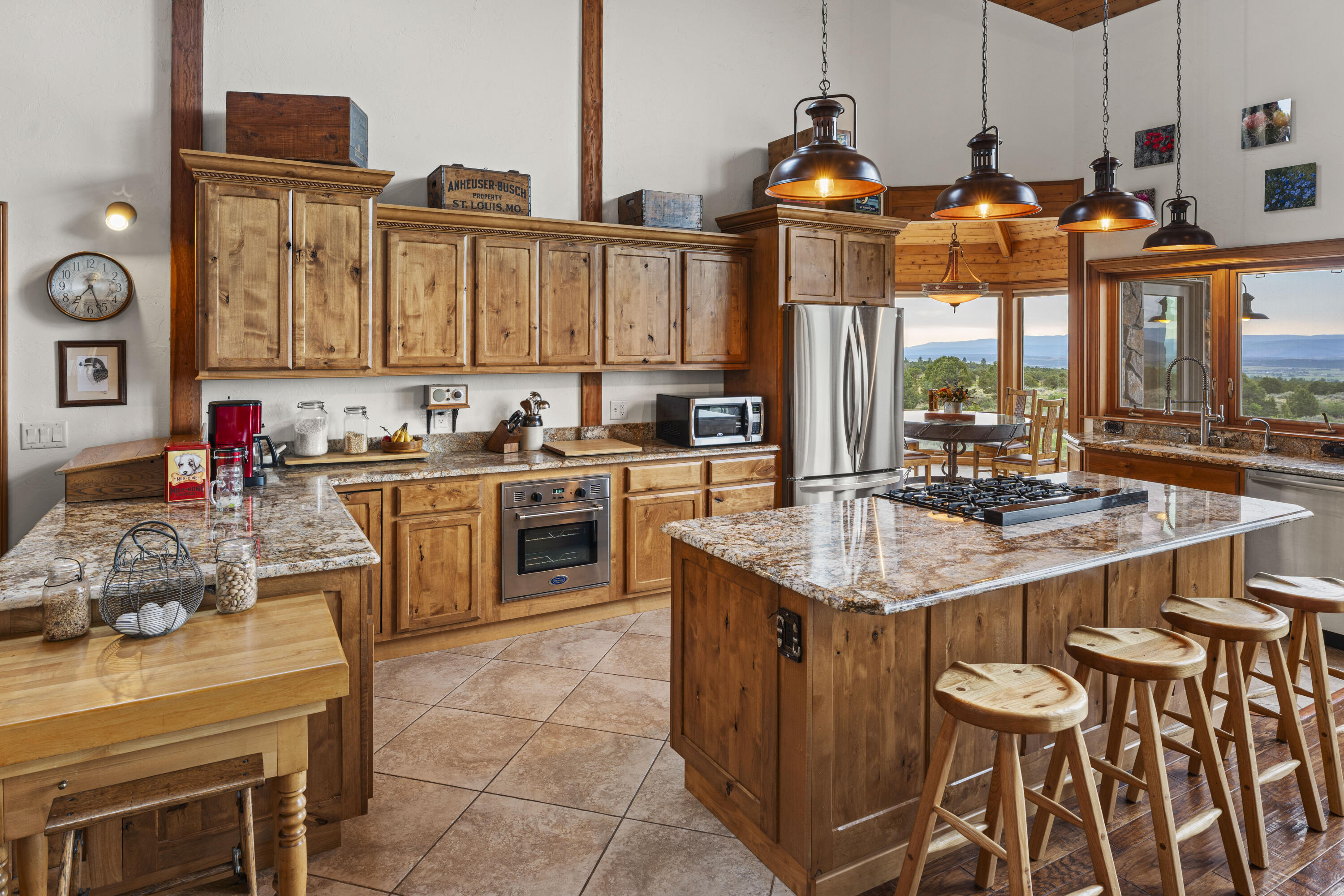 3100 South County Road Norwood, CO 81423 - Photo 17 of 44 a kitchen with stainless steel appliances a sink stove and a refrigerator
