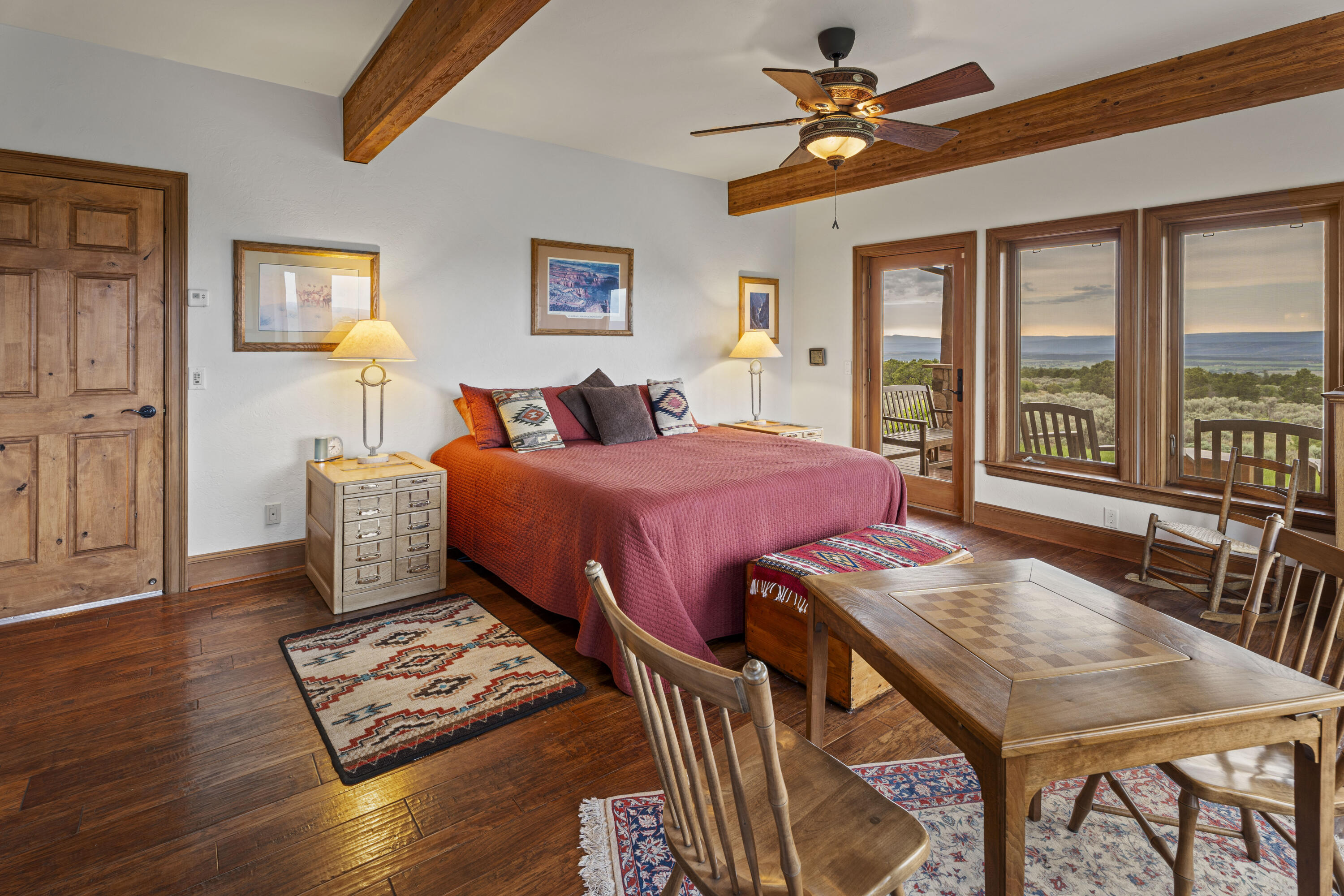 3100 South County Road Norwood, CO 81423 - Photo 21 of 44 a view of a dining room with furniture window and wooden floor