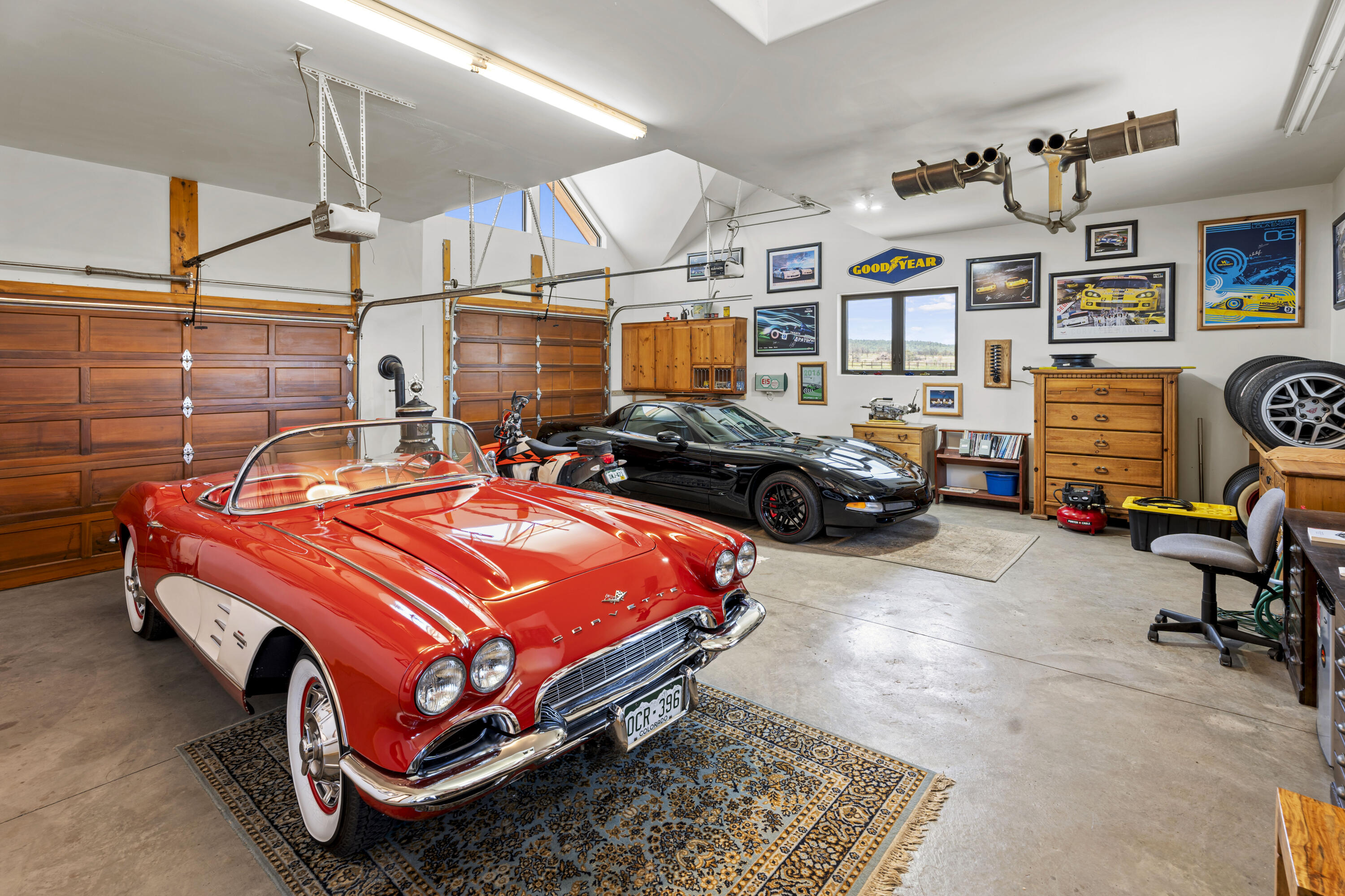 3100 South County Road Norwood, CO 81423 - Photo 33 of 44 a bedroom with bed and a chandelier