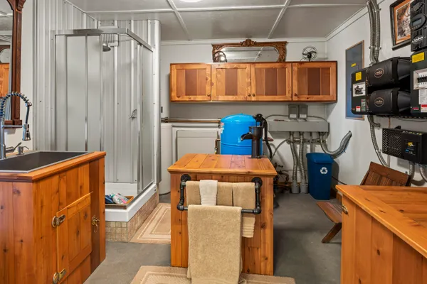 a utility room with multiple furniture and a window
