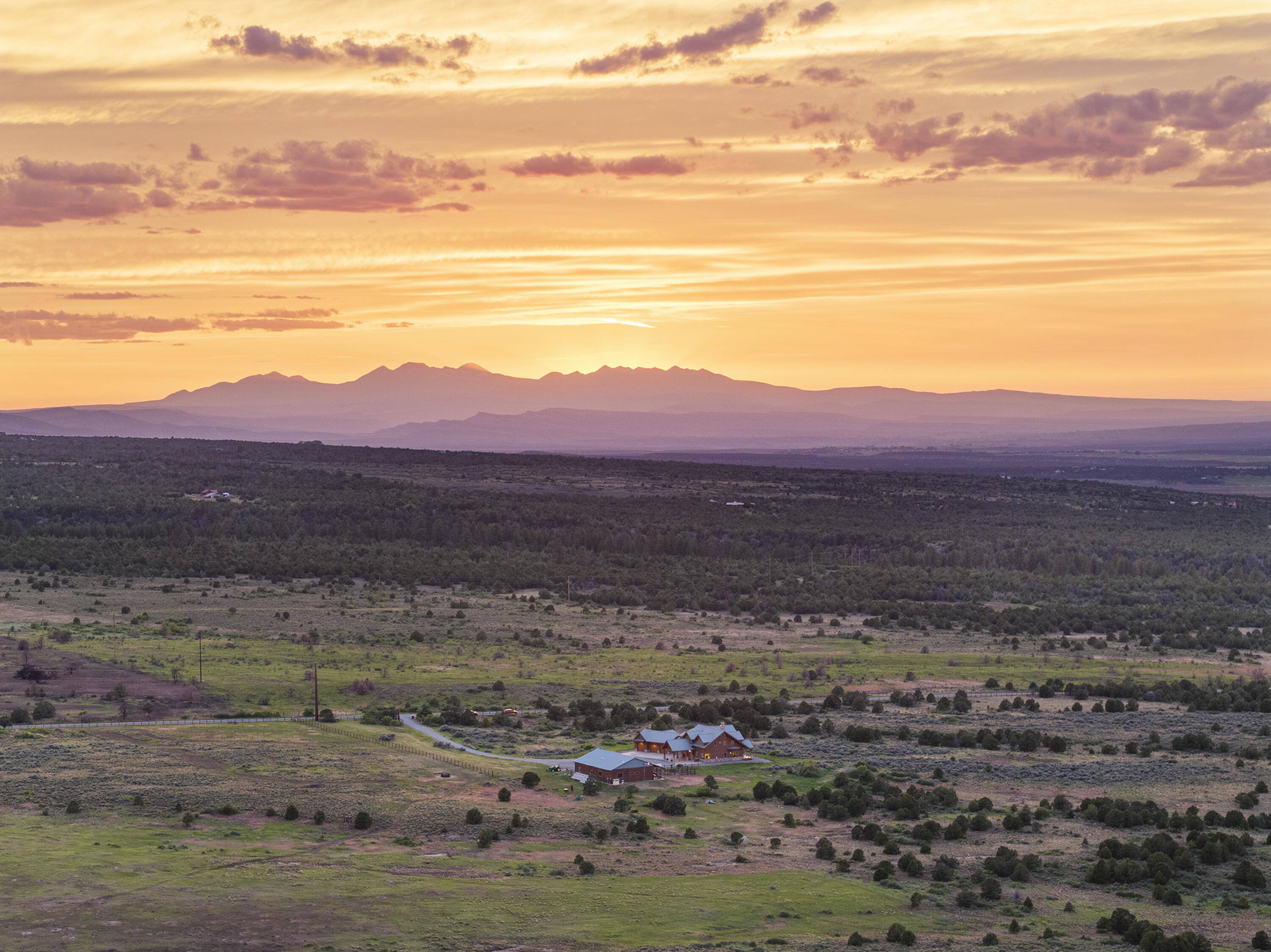 3100 South County Road Norwood, CO 81423 - Photo 5 of 44 a view of a big yard with mountain