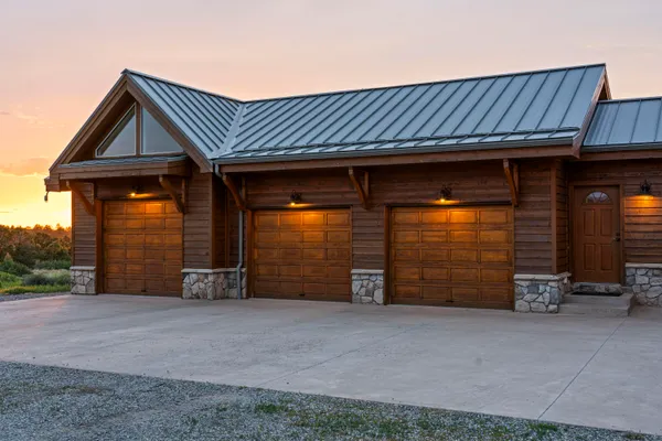 a view of a house with a garage and chair