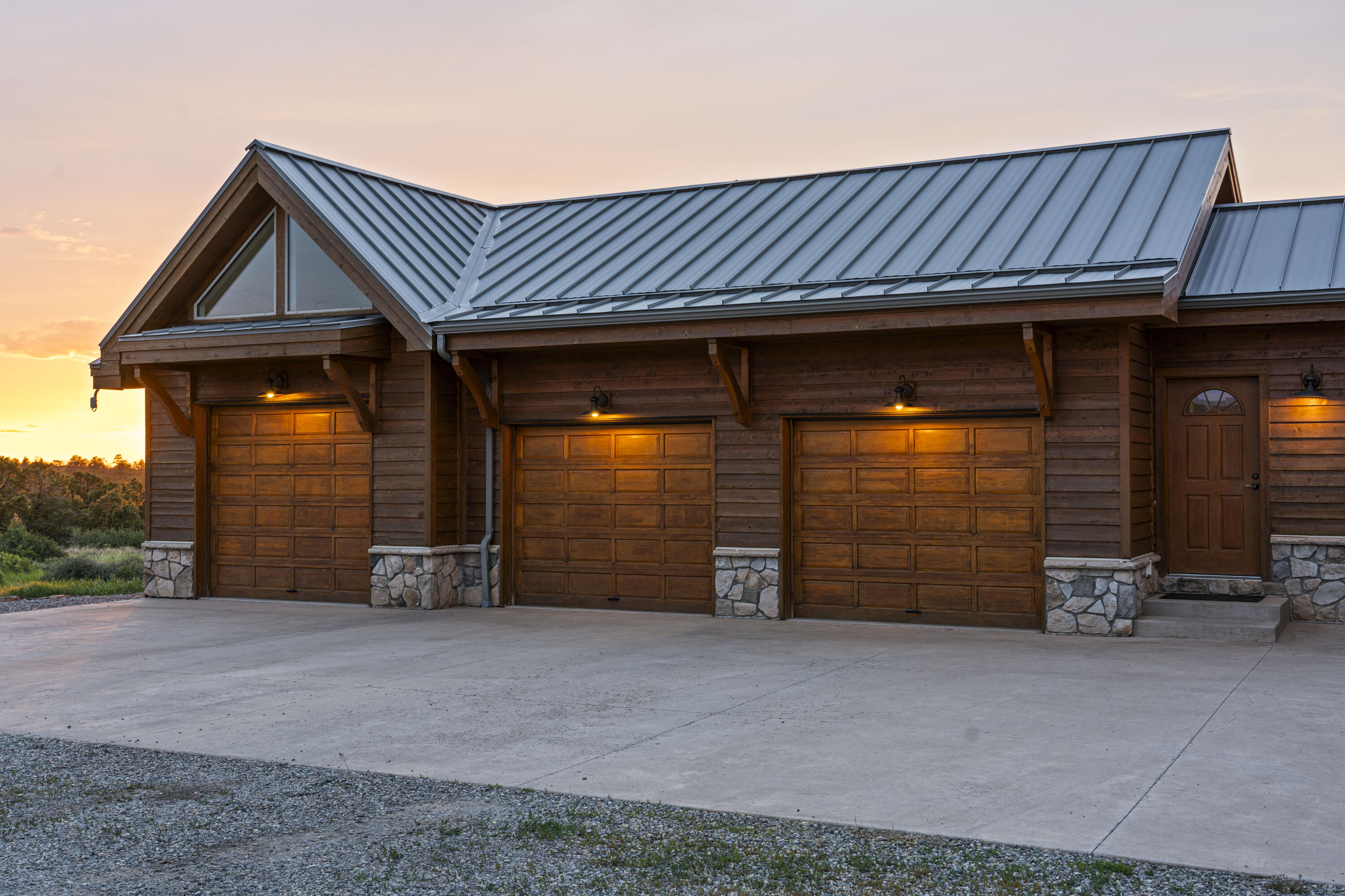 3100 South County Road Norwood, CO 81423 - Photo 10 of 44 a view of a house with a garage and chair
