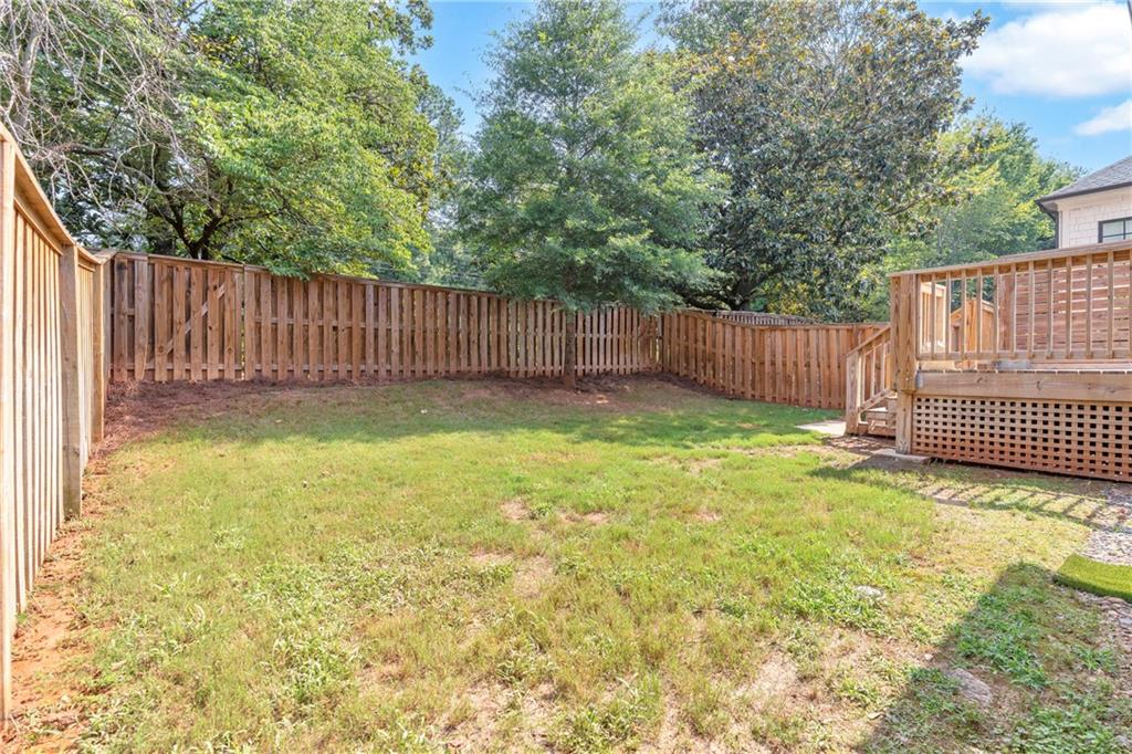 1141 Druid Fields Court Decatur, GA 30033 - Photo 29 of 35 a view of a yard with a fence and trees