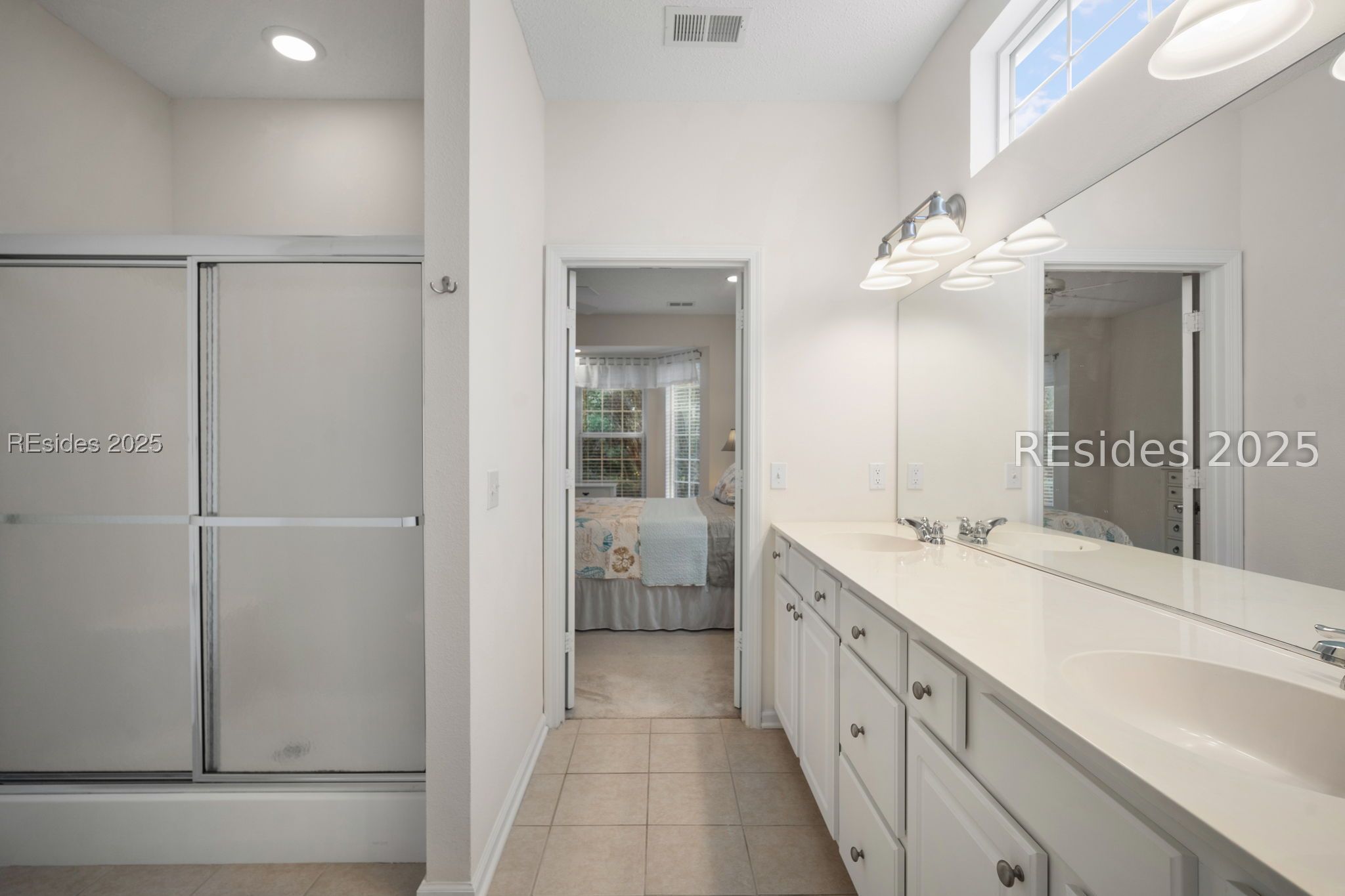 39 Nesting Lane Bluffton, SC 29909 - Photo 20 of 32 Primary bedroom with walk-in shower