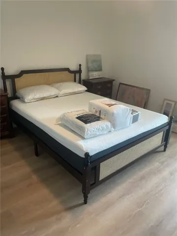 a bathroom with a toilet a sink and a mirror