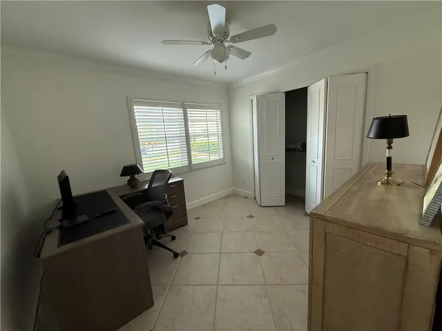a view of a dining room with furniture and window