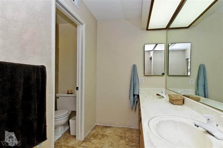 2704 Bitternut Circle Simi Valley, CA 93065 - Photo 11 of 25 a bathroom with a sink and a mirror