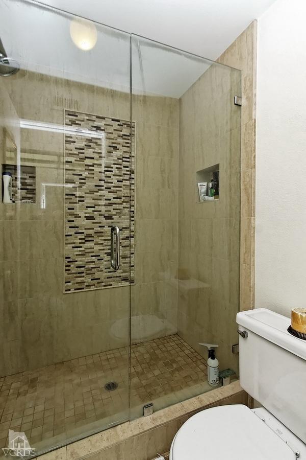 2704 Bitternut Circle Simi Valley, CA 93065 - Photo 12 of 25 a bathroom with a shower and a toilet