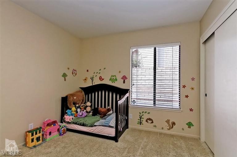 2704 Bitternut Circle Simi Valley, CA 93065 - Photo 13 of 25 a bedroom with furniture and a window
