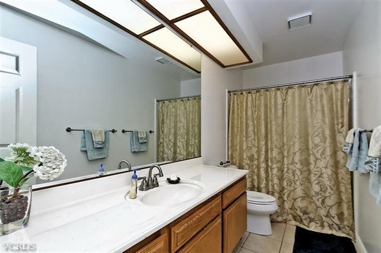 2704 Bitternut Circle Simi Valley, CA 93065 - Photo 15 of 25 a bathroom with a sink toilet and shower