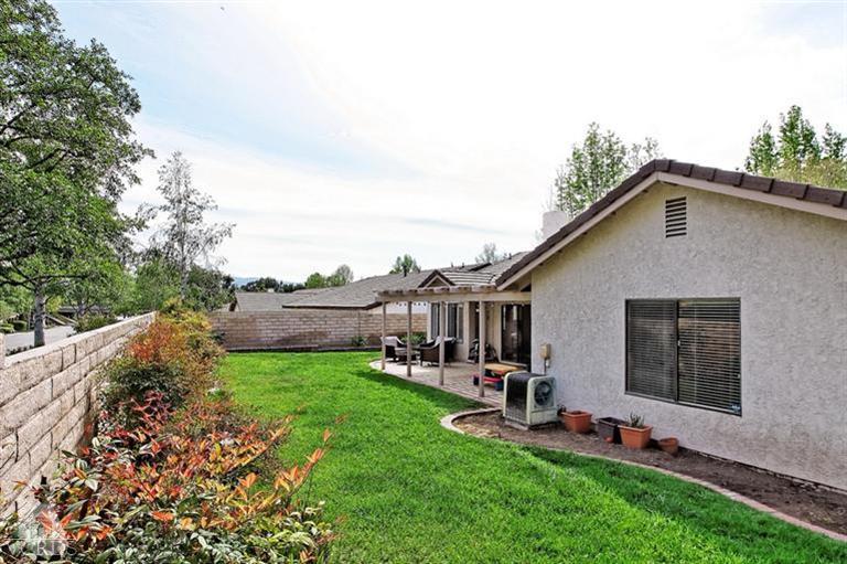 2704 Bitternut Circle Simi Valley, CA 93065 - Photo 21 of 25 a view of a yard with a house in the background
