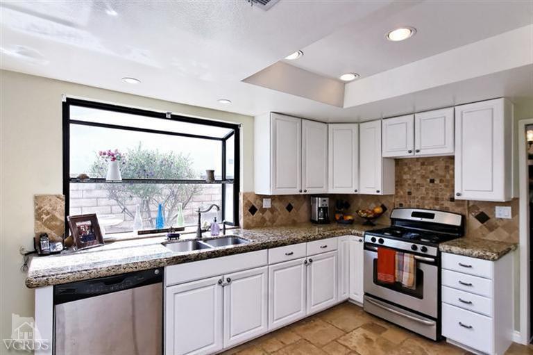 2704 Bitternut Circle Simi Valley, CA 93065 - Photo 5 of 25 a kitchen with granite countertop a stove a sink and a granite counter tops