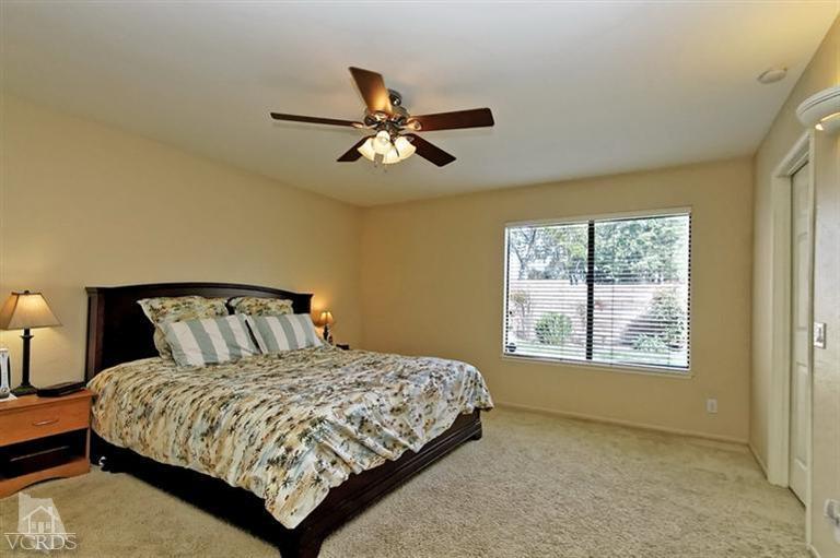 2704 Bitternut Circle Simi Valley, CA 93065 - Photo 10 of 25 a bedroom with a large bed and a window