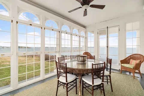 a view of a dining room with furniture window and outside view