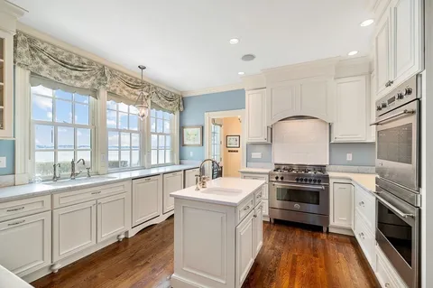 a kitchen with a sink stove and refrigerator