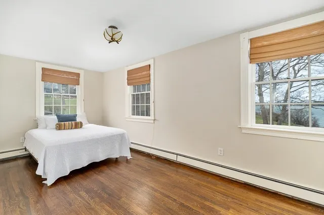 a room with a bed and a window