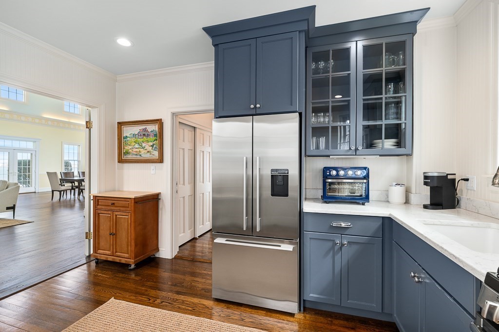 66 Ocean Street Nahant, MA 01908 - Photo 33 of 40 a kitchen with granite countertop stainless steel appliances and wooden cabinets