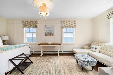 a living room with furniture and a table