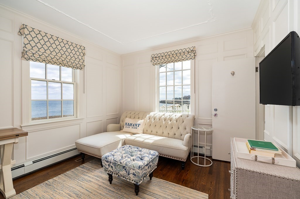 66 Ocean Street Nahant, MA 01908 - Photo 35 of 40 a living room with furniture wooden floor and a flat screen tv