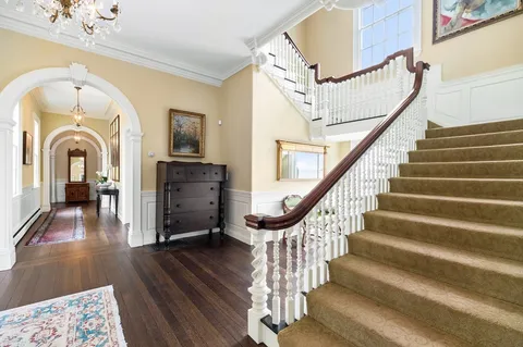 a view of entryway with wooden floor