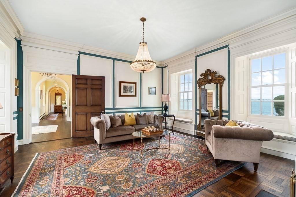 66 Ocean Street Nahant, MA 01908 - Photo 7 of 40 a living room with furniture and a chandelier